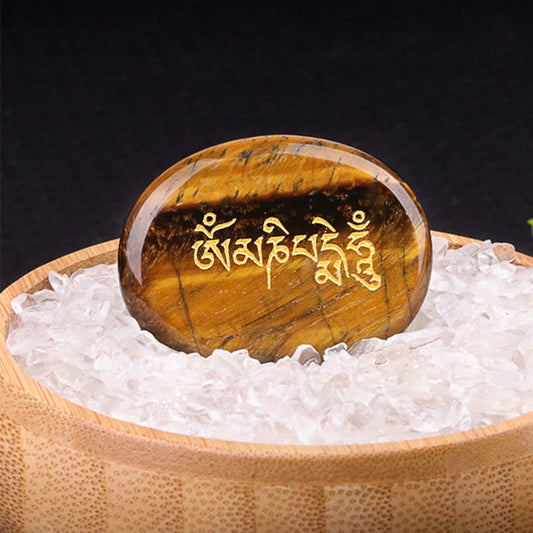 Om Mani Padme Hum Palm Stone – Golden tiger eye with mantra engraving in wooden bowl
