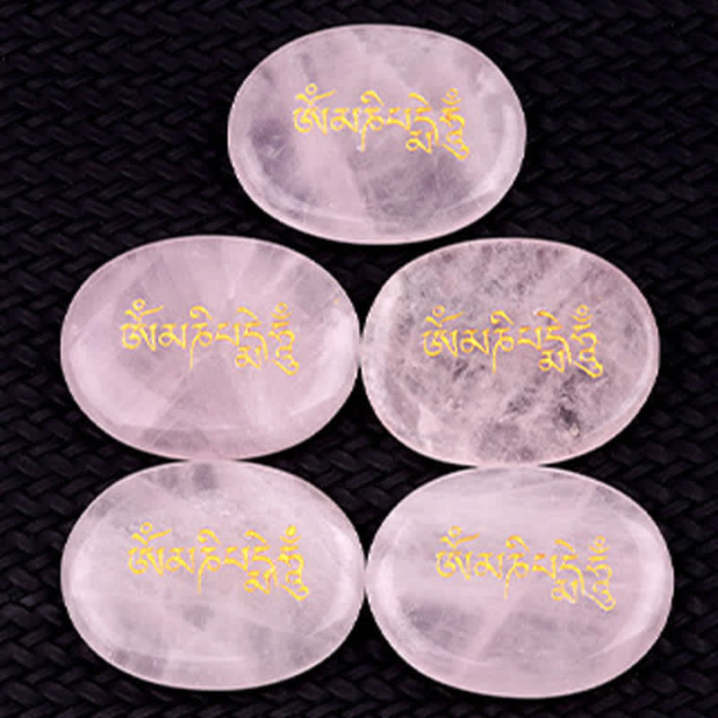 Om Mani Padme Hum Palm Stone – Five pink rose quartz stones on dark woven mat, love stone
