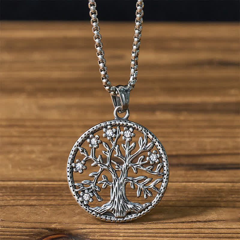 Tree of Life Titanium Steel Necklace – Silver pendant with crystal accents on box chain, wooden background