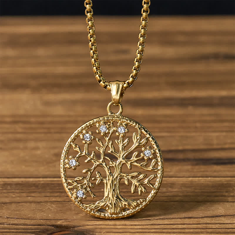 Tree of Life Titanium Steel Necklace – Gold pendant with crystal accents on box chain, wooden backdrop