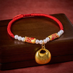 Red String Koi Fish Pet Collar – three-quarter on dark wood, red braided cord, gold fu lock, koi beads, pearls