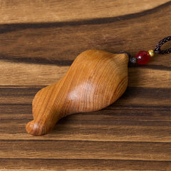 Guanyin Avalokitesvara Platycladus Wood Wealth Necklace Pendant – side view showing carved depth, artisan craft detail