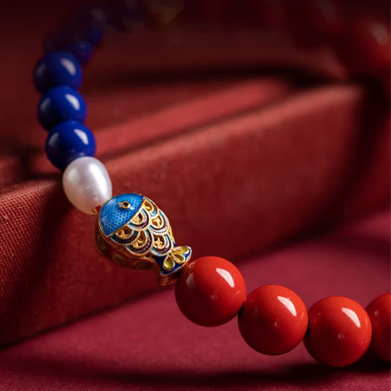 Cinnabar Lapis Lazuli Koi Fish Bracelet – macro detail of cloisonne koi charm and bead color transition