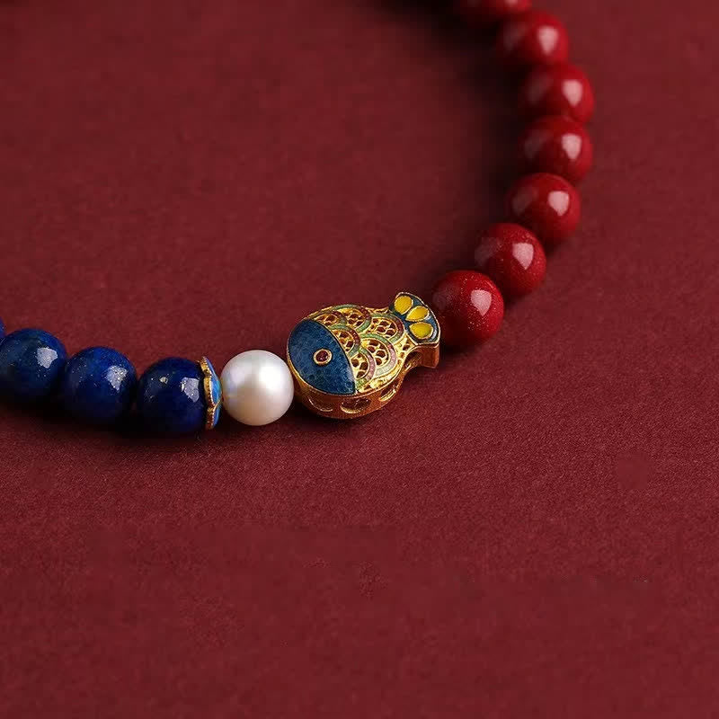 Cinnabar Lapis Lazuli Koi Fish Bracelet – close-up of lapis to cinnabar color transition with koi charm