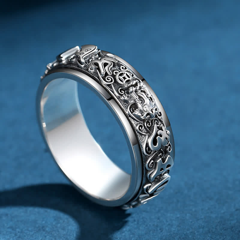 Pixiu Om Mani Padme Hum Copper Rotatable Ring for Men – Tilted angle view on blue background, spinner ring