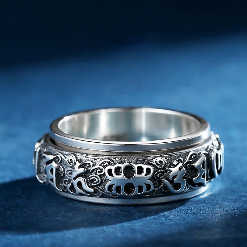 Pixiu Om Mani Padme Hum Copper Rotatable Ring for Men – Flat lay showing engraved band on blue, wealth ring