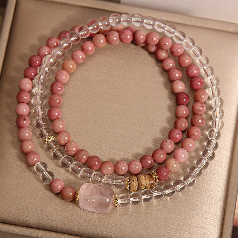 Rhodonite Clear Quartz Rose Quartz Pixiu Triple Wrap Bracelet – top view three strands on gold box showing bead pattern