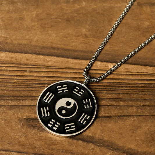 Yin Yang Bagua Pendant - Diagonal close-up of silver Bagua trigram ring with black inlay, tai chi necklace