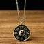 Yin Yang Bagua Pendant - Front view showing silver Taijitu and Eight Trigrams on black enamel, yin yang necklace