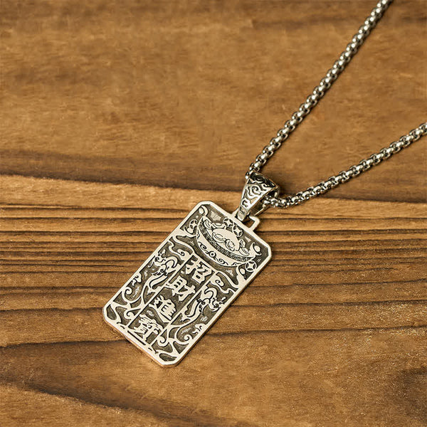 Copper Pixiu Chain Wealth Necklace Pendant - Feng Shui Attract – Back tilted showing engraved symbols on wood