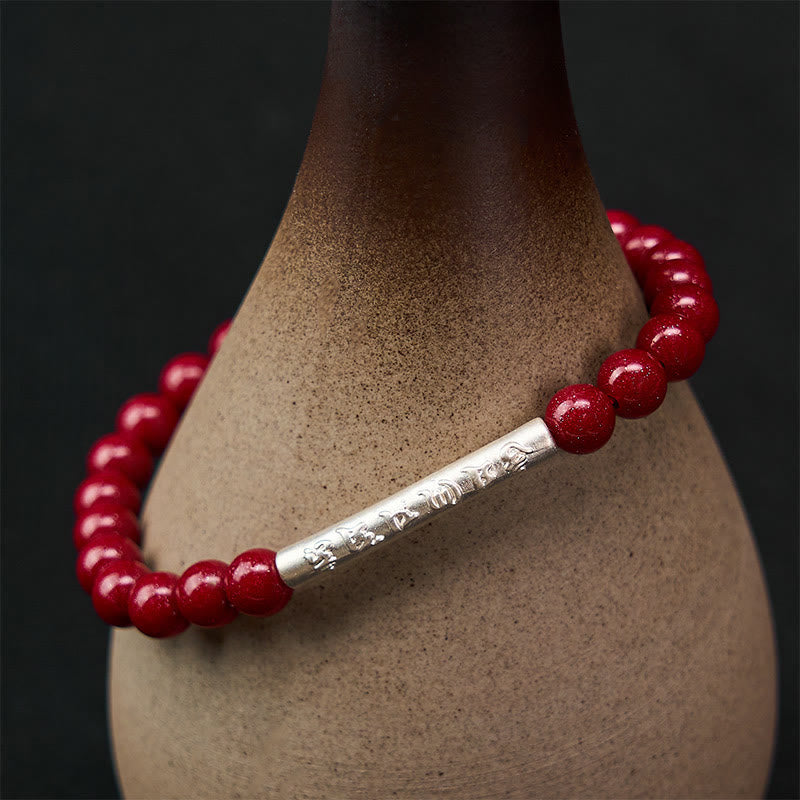 Sterling Silver Om Mani Padme Hum Bracelet – Silver mantra tube on handmade pottery vase, red bead bracelet