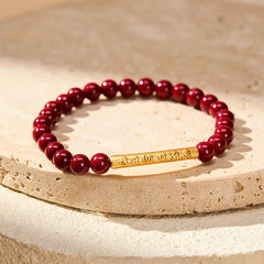 Cinnabar Om Mani Padme Hum Bracelet – Gold mantra bead on stone pedestal, red cinnabar beaded bracelet