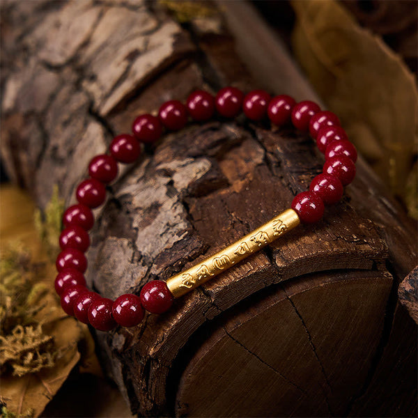 Cinnabar Om Mani Padme Hum Bracelet – Gold mantra bead on weathered wood, natural cinnabar jewelry