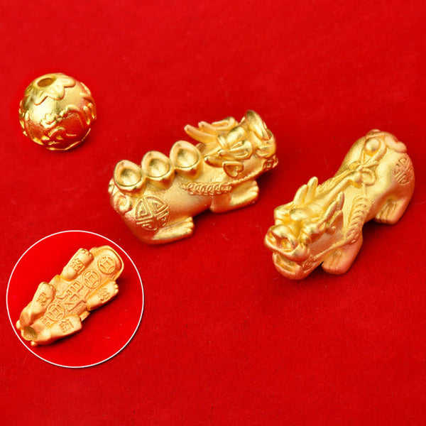 Natural Tiger Eye Pixiu Fu Om Mani Padme Hum Bracelet – golden Pixiu charm components on red background showing craftsmanship