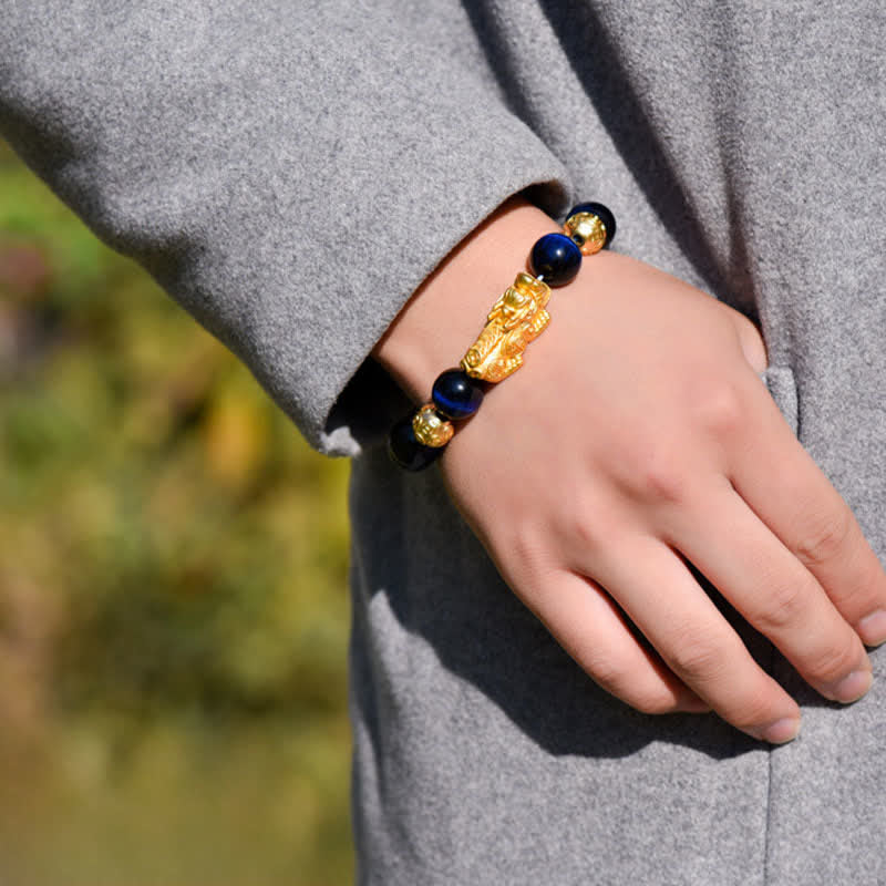 Natural Tiger Eye Pixiu Fu Om Mani Padme Hum Bracelet – blue tiger eye bracelet on wrist with grey jacket outdoor setting
