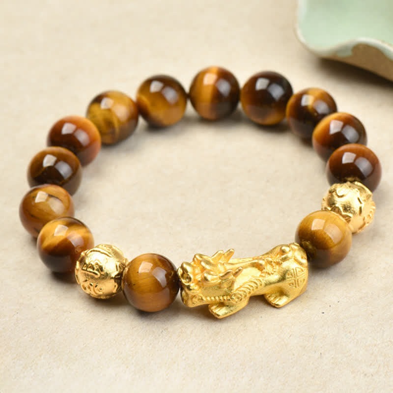 Natural Tiger Eye Pixiu Fu Om Mani Padme Hum Bracelet – golden Pixiu with brown tiger eye beads, side view cream background