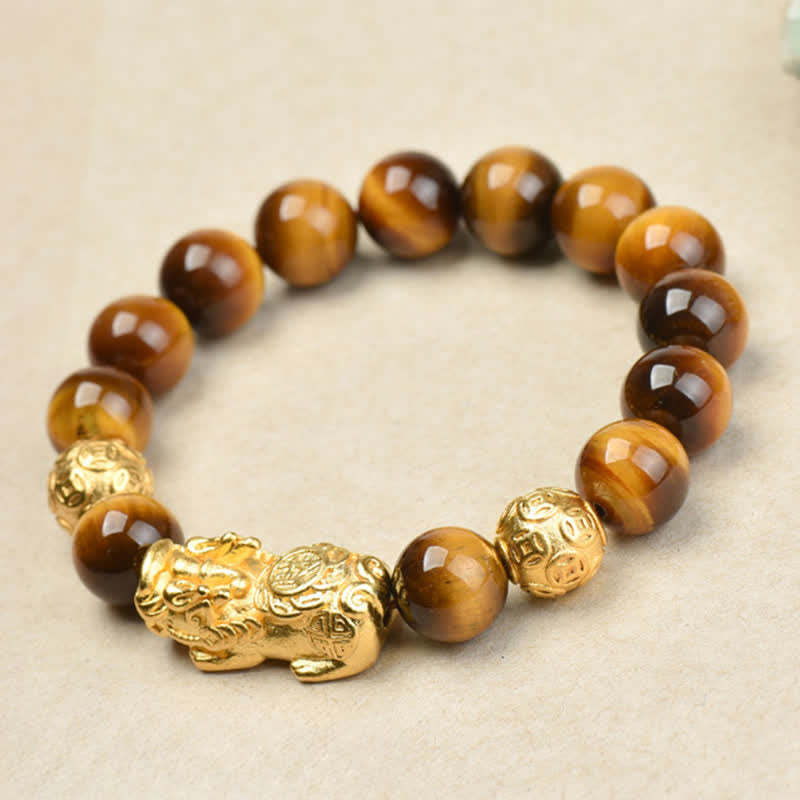 Natural Tiger Eye Pixiu Fu Om Mani Padme Hum Bracelet – close-up golden Pixiu facing left with brown tiger eye beads