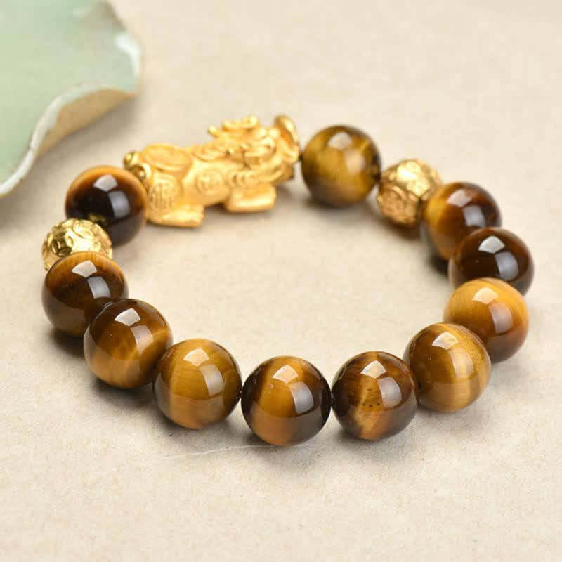 Natural Tiger Eye Pixiu Fu Om Mani Padme Hum Bracelet – angled view golden Pixiu detail and brown tiger eye bead pattern