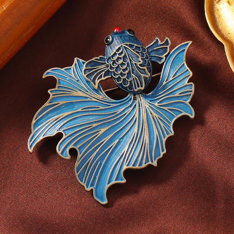 Cloisonne Enamel Blue Koi Fish Brooch – cobalt blue enamel koi on brown fabric with gold frame props