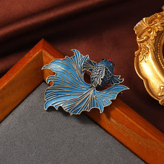 Cloisonne Enamel Blue Koi Fish Brooch – light to dark blue gradient with red dot on gray felt surface