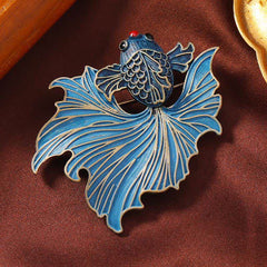 Cloisonne Enamel Blue Koi Fish Brooch – cobalt blue enamel koi on brown fabric with gold frame props