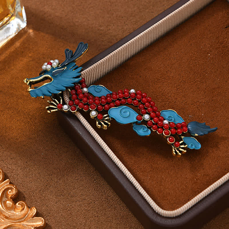 Blue Dragon Red Turquoise Luck Brooch – Teal enamel dragon, red beaded body on brown suede tray, Auspicious