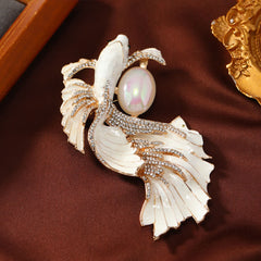 Glazed Koi Fish Pearl Brooch – ivory white enamel koi cradling pearl, ornate gold frame backdrop