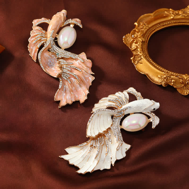 Glazed Koi Fish Pearl Brooch – two colorways peach and white displayed on brown velvet fabric