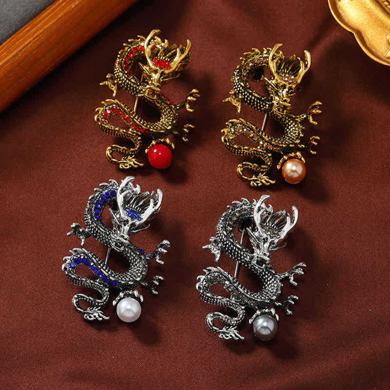Domineering Dragon Pearl Strength Alloy Brooch – four color variants gold red silver blue gray on burgundy, power