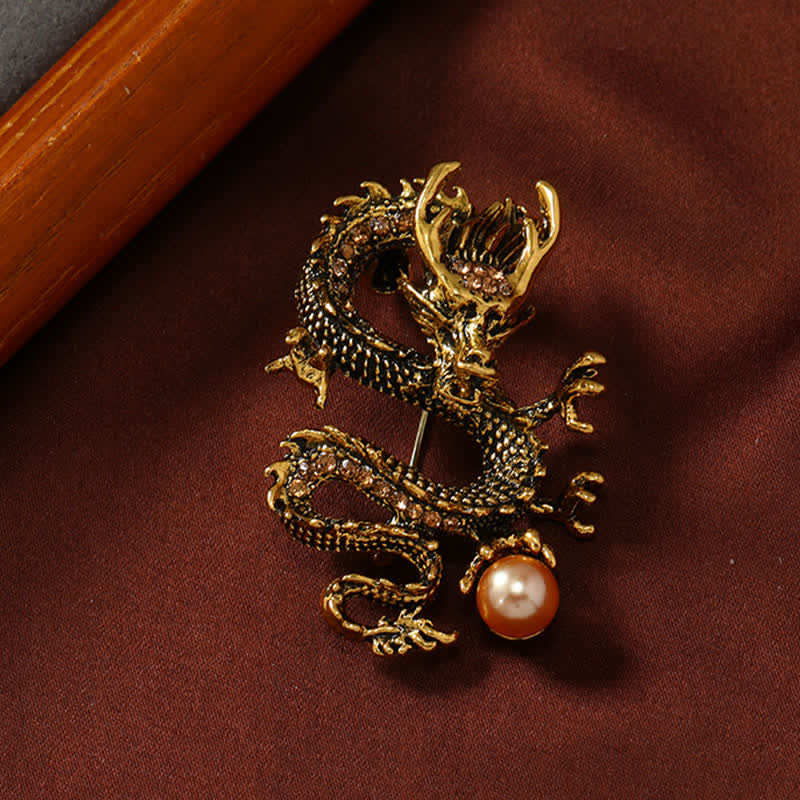Domineering Dragon Pearl Strength Alloy Brooch – antiqued gold dragon clutching pearl with champagne stones, luck