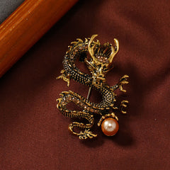 Domineering Dragon Pearl Strength Alloy Brooch – antiqued gold dragon clutching pearl with champagne stones, luck