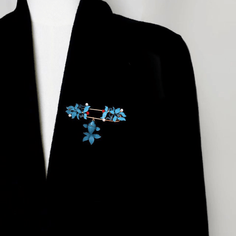 Cloisonne Koi Fish Brooch - turquoise floral brooch with pearl accents on black coat lapel