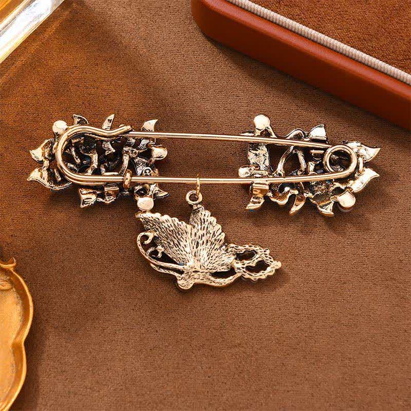 Cloisonne Koi Fish Brooch - antique gold filigree brooch with butterfly charm on brown fabric