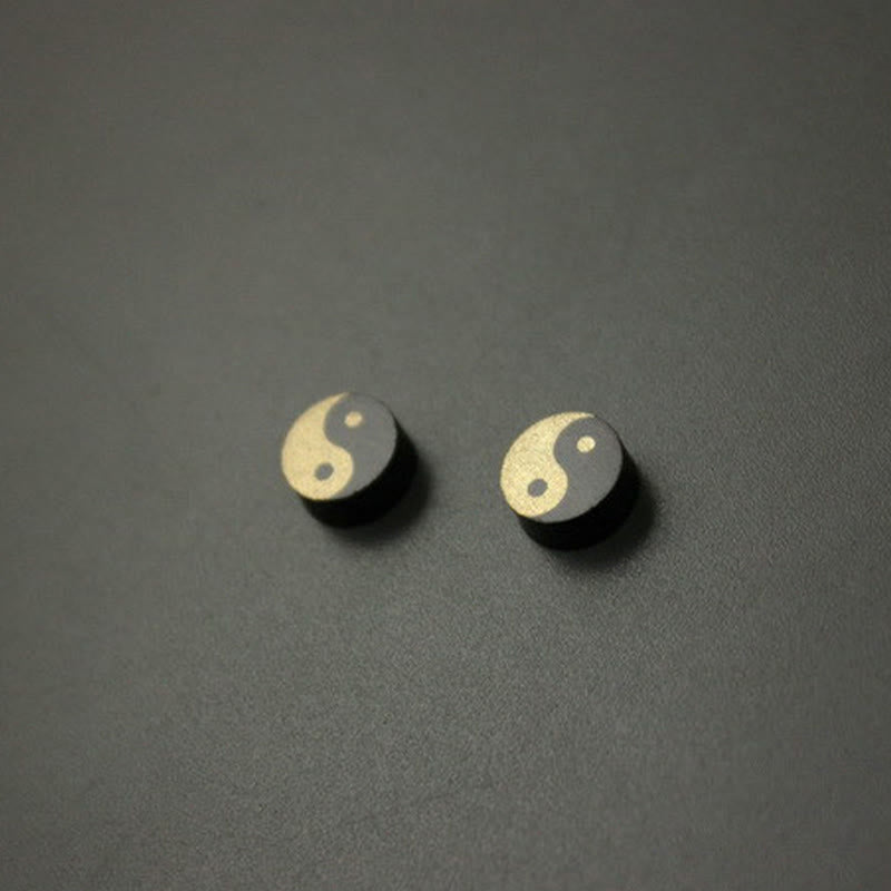 Ebony Wood Yin Yang Stud Earrings - Pair of gold and black yin yang studs on dark gray, minimalist zen earrings