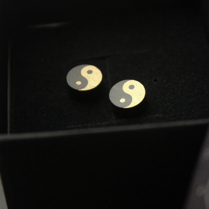 Ebony Wood Yin Yang Stud Earrings - Gold and black yin yang studs in black velvet display, spiritual earrings