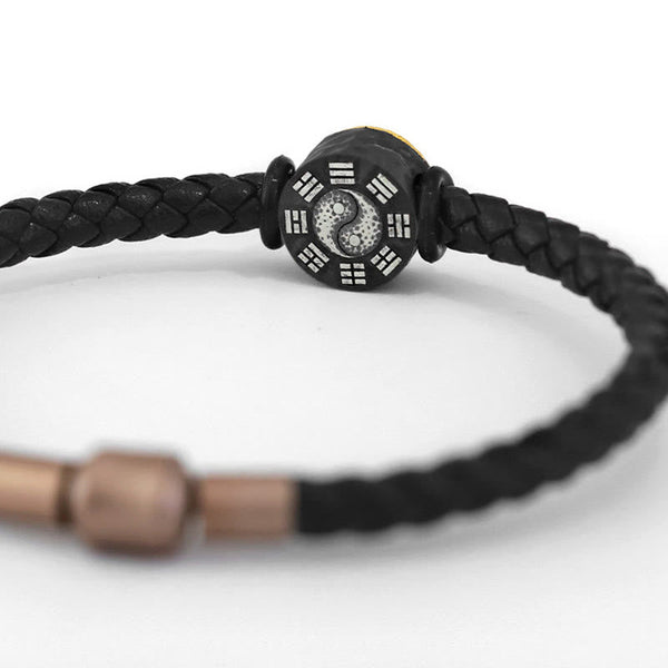 Yin Yang Bagua Leather Bracelet - White background shot showing bagua trigrams and yin yang bead, Taoist jewelry