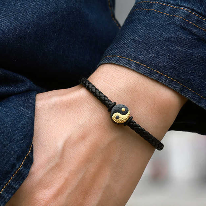 Yin Yang Bagua Leather Bracelet - Worn on wrist with dark denim showing gold yin yang charm, leather bracelet men