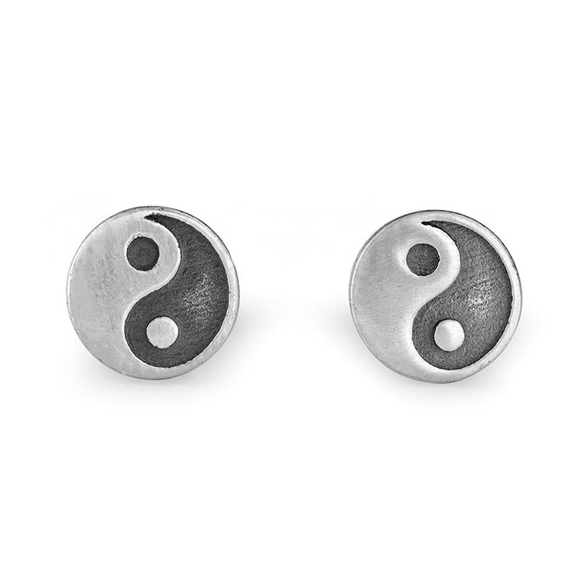 Yin Yang Stud Earrings - Clean white background front view, silver yin yang disc studs, minimalist earrings