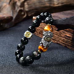 Natural Black Obsidian PiXiu Tiger's Eye Bracelet – close-up silver PiXiu, obsidian and tiger eye beads, feng shui wealth