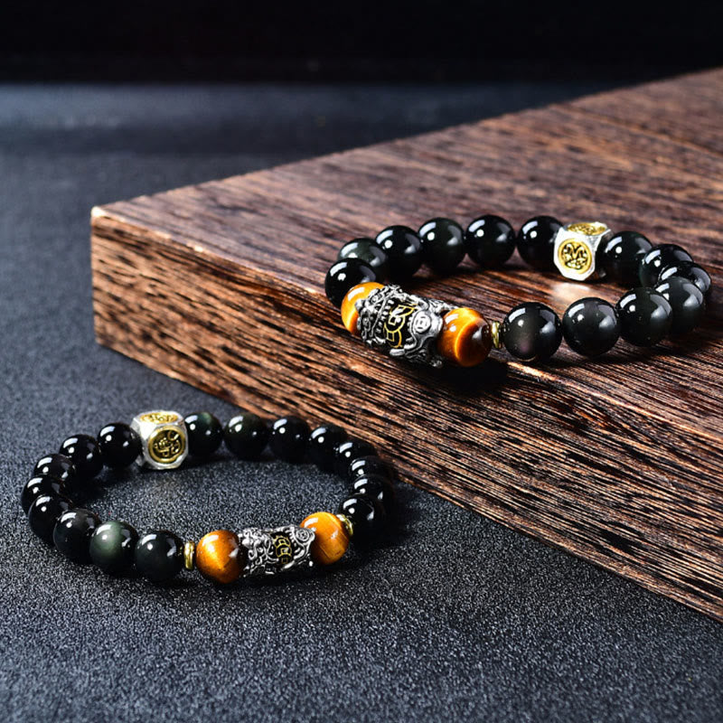 Natural Black Obsidian PiXiu Tiger's Eye Bracelet – pair on wooden plank and dark surface, wealth luck bead bracelet duo