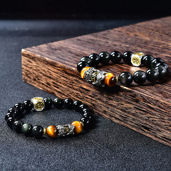 Natural Black Obsidian PiXiu Tiger's Eye Bracelet – pair on wooden plank and dark surface, wealth luck bead bracelet duo