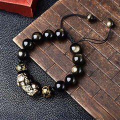 Gold Sheen Obsidian PiXiu Bracelet – Alternate top view on bamboo, glossy beads, gold Pi Xiu, Om Mani Padme Hum spacer
