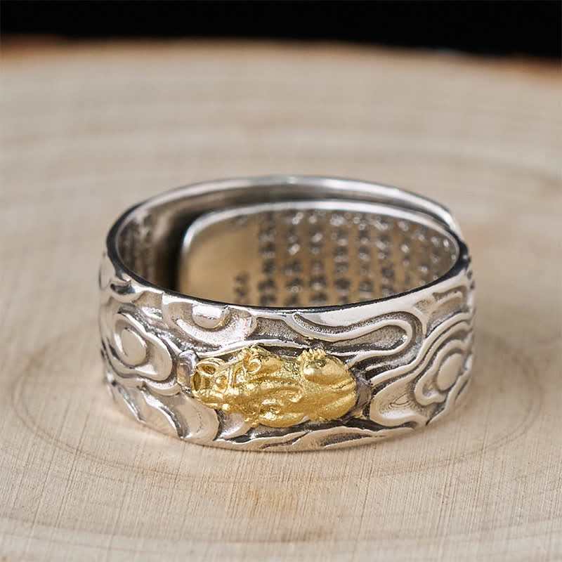 PiXiu Heart Sutra Copper Ring – Top view on light wood, gold Pi Xiu centerpiece, mantra text inside band, feng shui