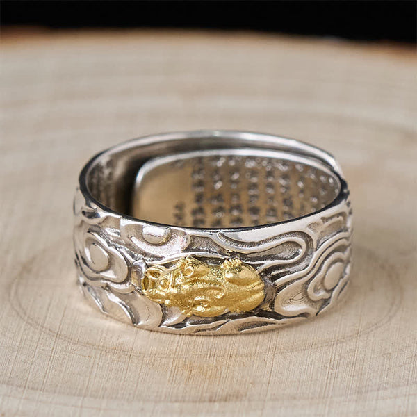 PiXiu Heart Sutra Copper Ring – Top view on light wood, gold Pi Xiu centerpiece, mantra text inside band, feng shui