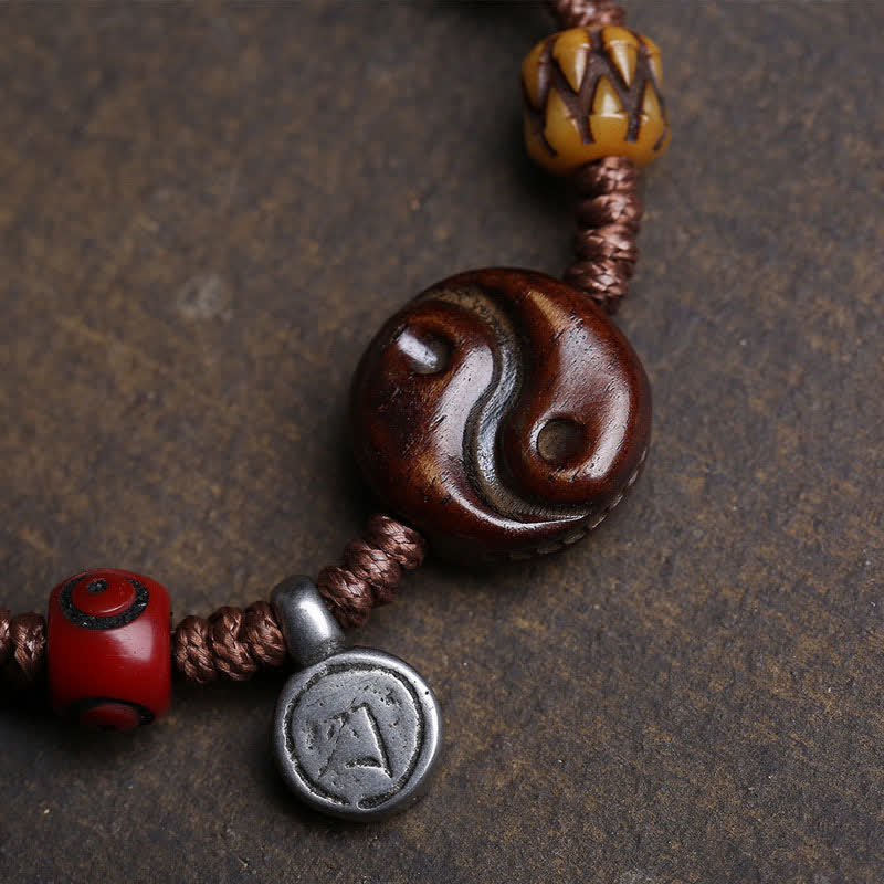 Yin Yang Bone Bracelet - bone beads and amber charm on dark cord, ethnic healing bracelet
