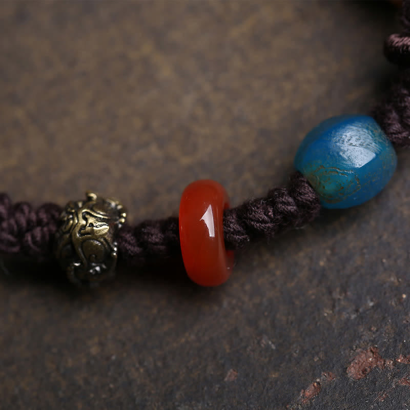 Bone PiXiu Braided Rope Bracelet – Red agate and blue bead detail with brass lion head spacer, handmade braided cord