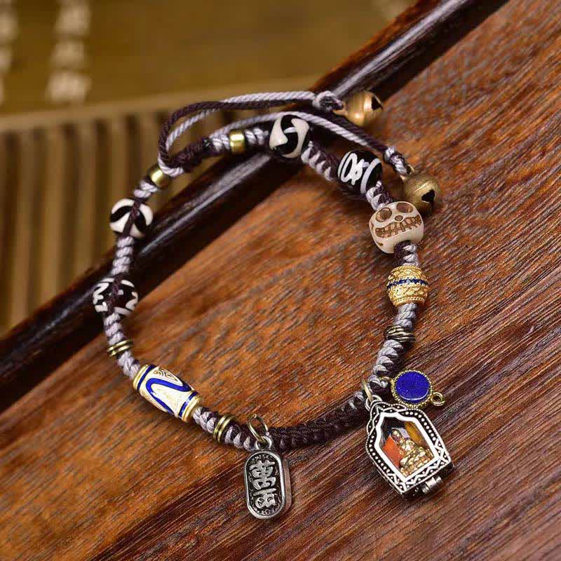 Copper Buddha Braided Rope Compassion Bracelet – close-up of copper Buddha charm on woven red rope, spiritual jewelry