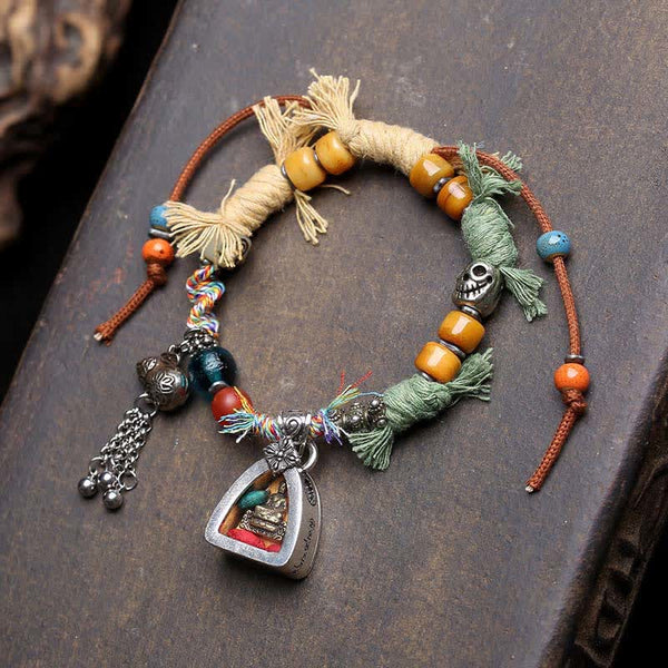 Copper Buddha Amitabha Bracelet – bracelet laid flat showing full length and charm, copper bracelet, Amitabha charm, rope