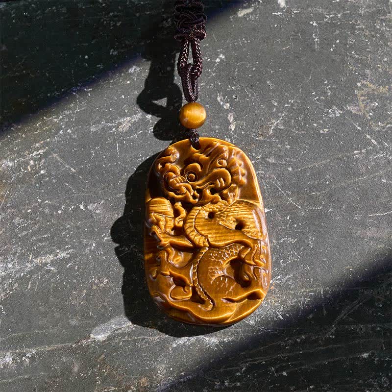 Tiger Eye Carved Dragon Rope Protection Necklace – overhead view of carved dragon scales and cloud motifs, power