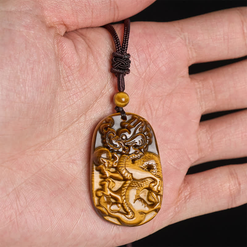 Tiger Eye Carved Dragon Rope Protection Necklace – carved dragon pendant in palm showing actual size, protection